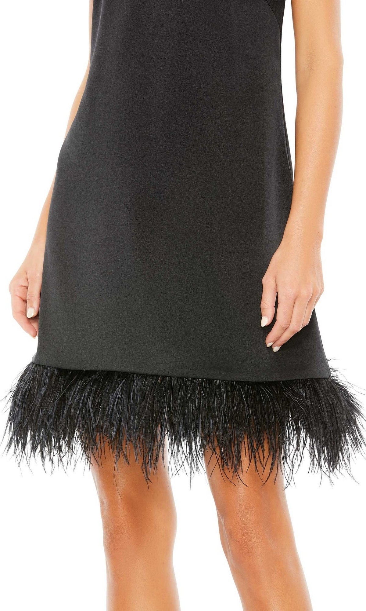 A woman wears the Mac Duggal 55805 Short Sheath Wedding Guest Dress—sleeveless, black, with a feathered hemline—standing with her arms relaxed by her sides.